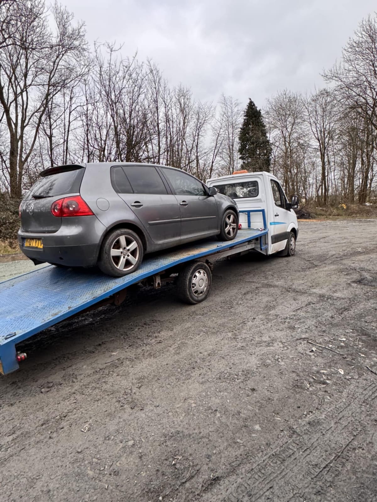Truck loading a vehicle
