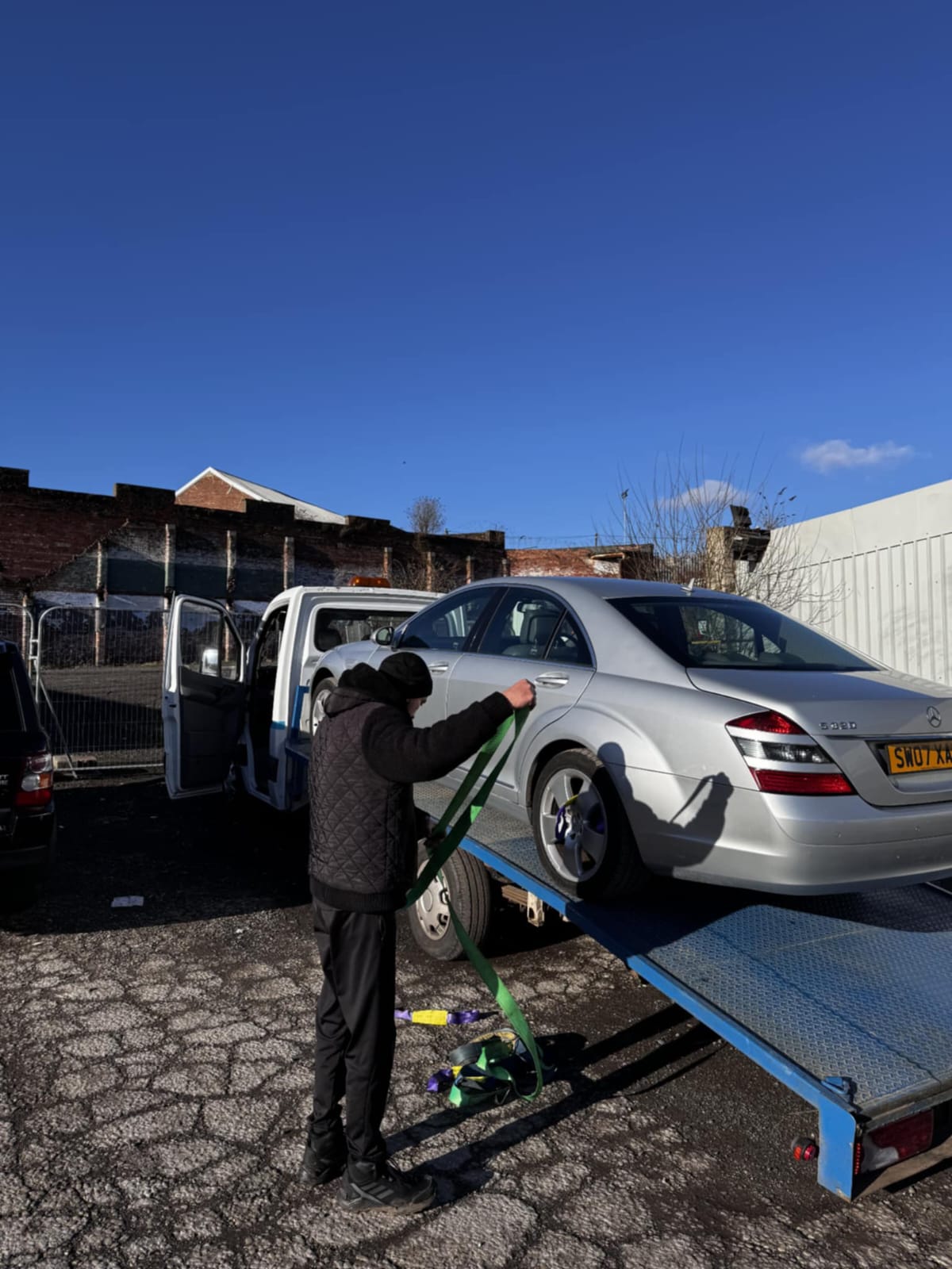 Truck loading a vehicle